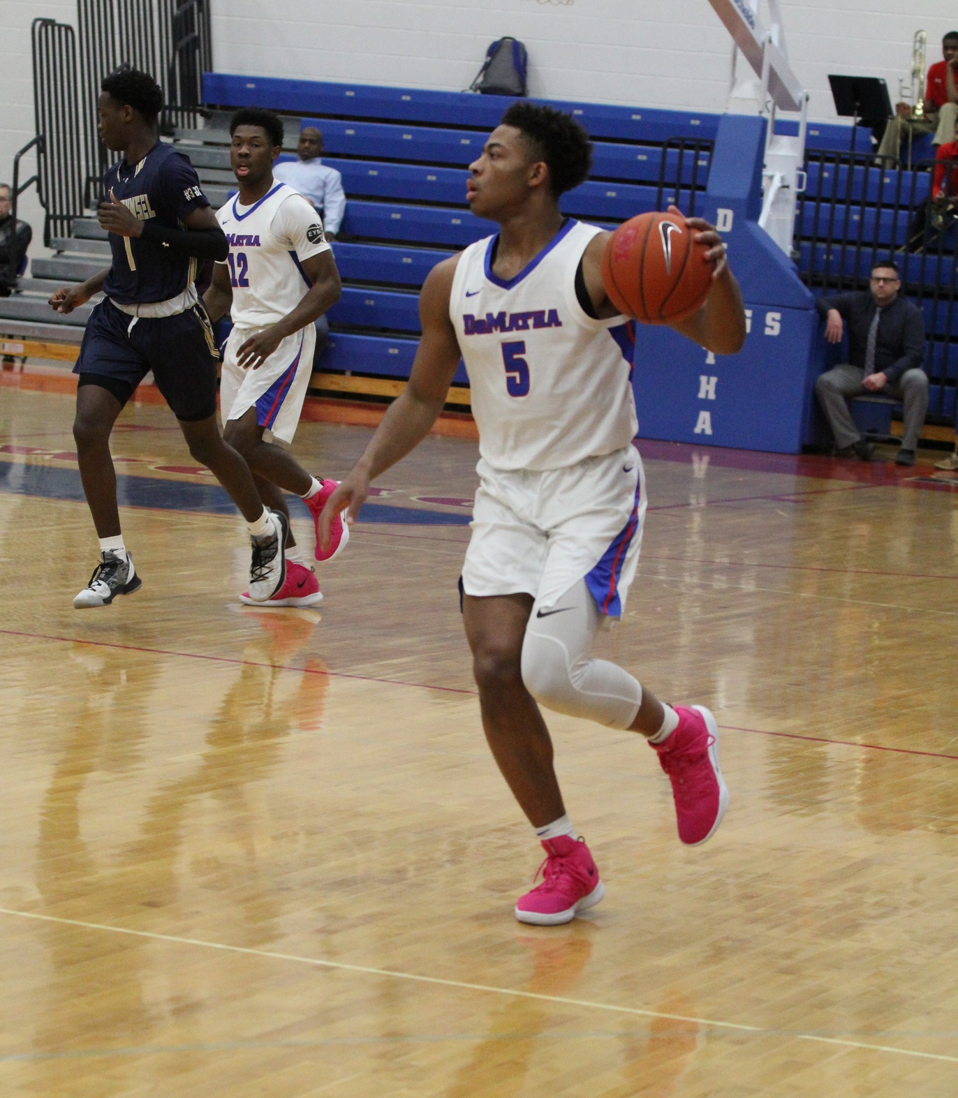 With the win in the Alhambra Championship game, DeMatha Senior Justin Moore (#5) set the program's record for varsity wins with 123.