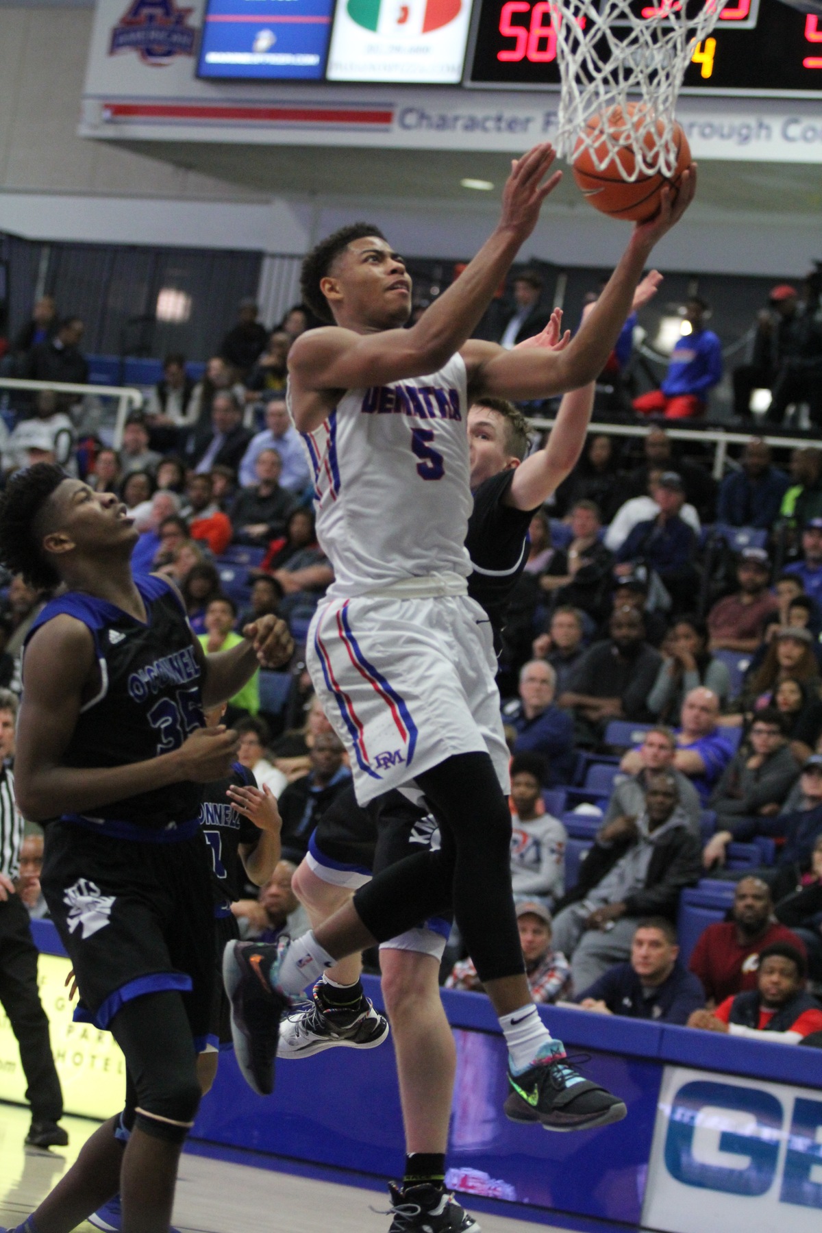 DeMatha Junior Justin Moore's breakout third quarter powers the Stags to the WCAC Championship, where they will face Gonzaga.